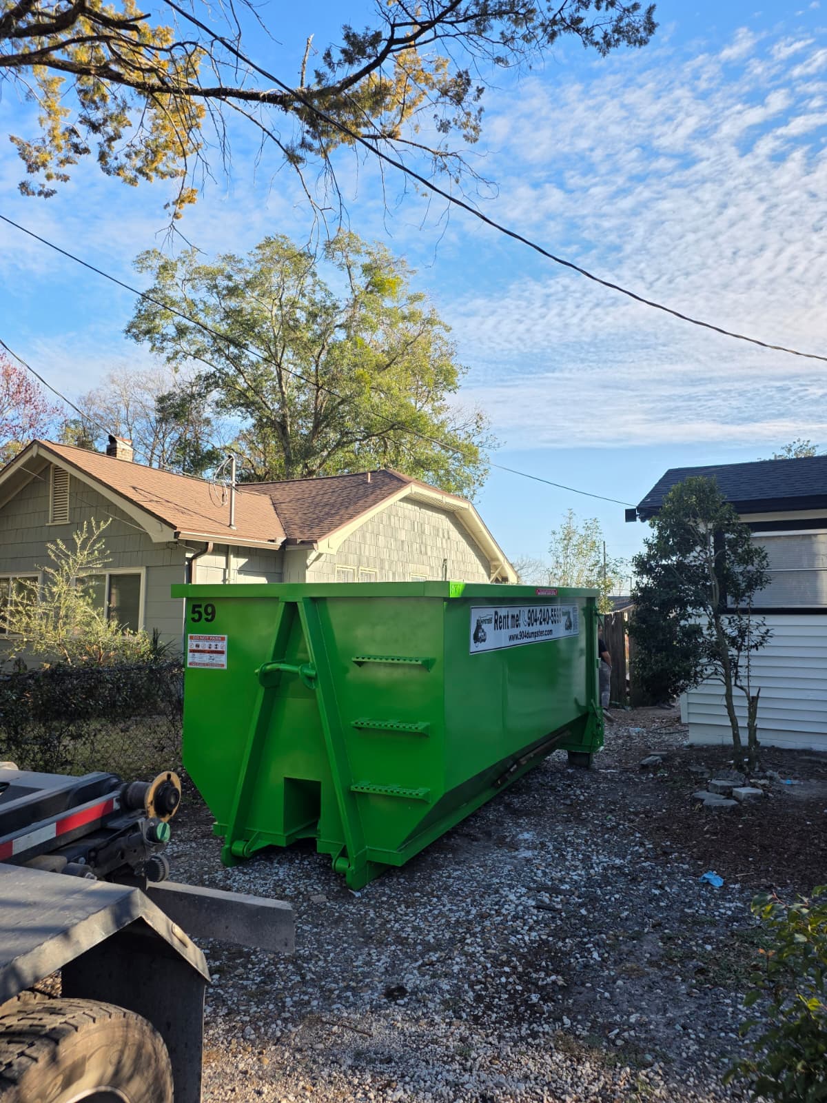 Residential Dumpster Rental Jacksonville FL - How It Works Residential dumpster rental delivery in Jacksonville FL - 904 Dumpster in side yard